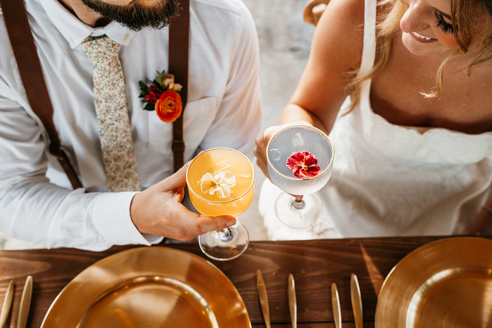 Newlyweds cheering their glasses during wedding celebration at Norse Flora event venue